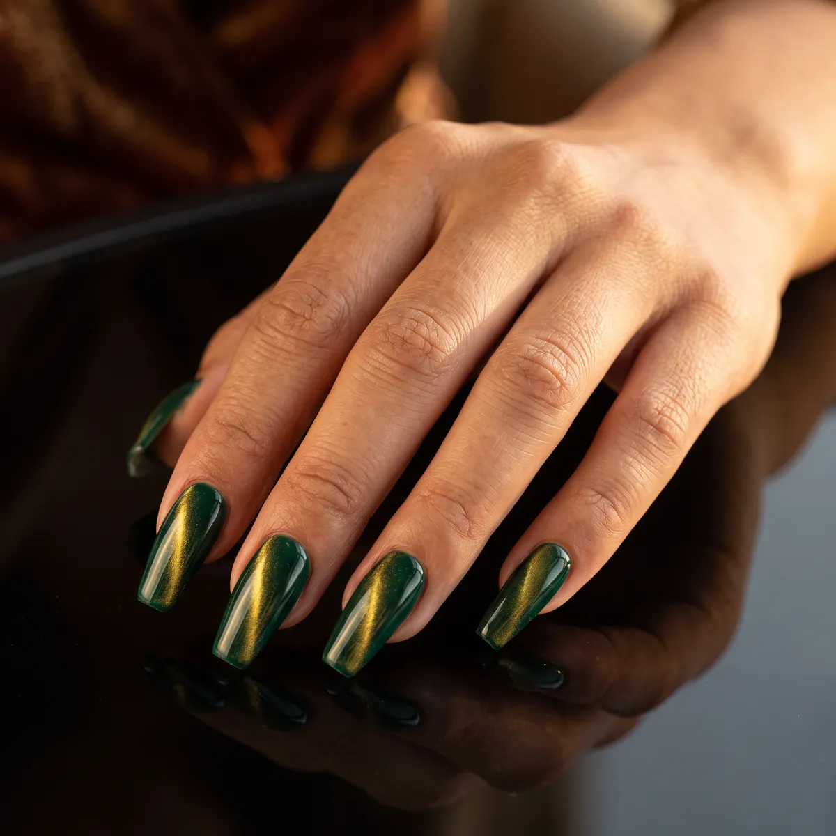 Emerald Flicker — coffin cat eye nails with use a deep emerald gel base, layer a gold magnetic top coat, drag the light band lengthwise, and…