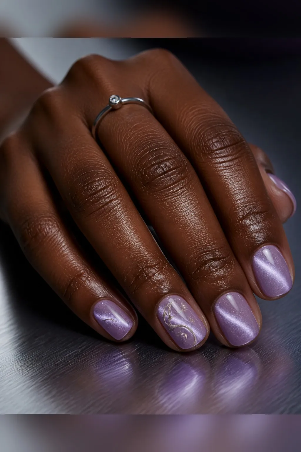 Lavender Haze Short — round cat eye nails with soft lavender magnetic cat-eye polish with a pearl shimmer flash, subtle, glossy, short round