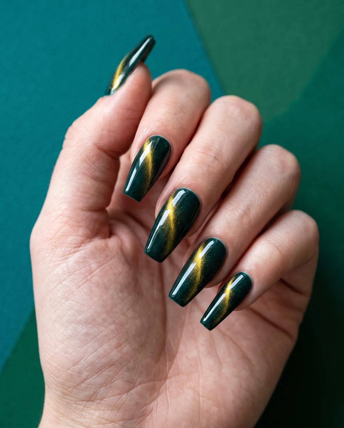 Midnight Teal Cat Eye — coffin cat eye nails with please use a blackened teal gel base with a gold magnetic sweep, coffin shape, long length…