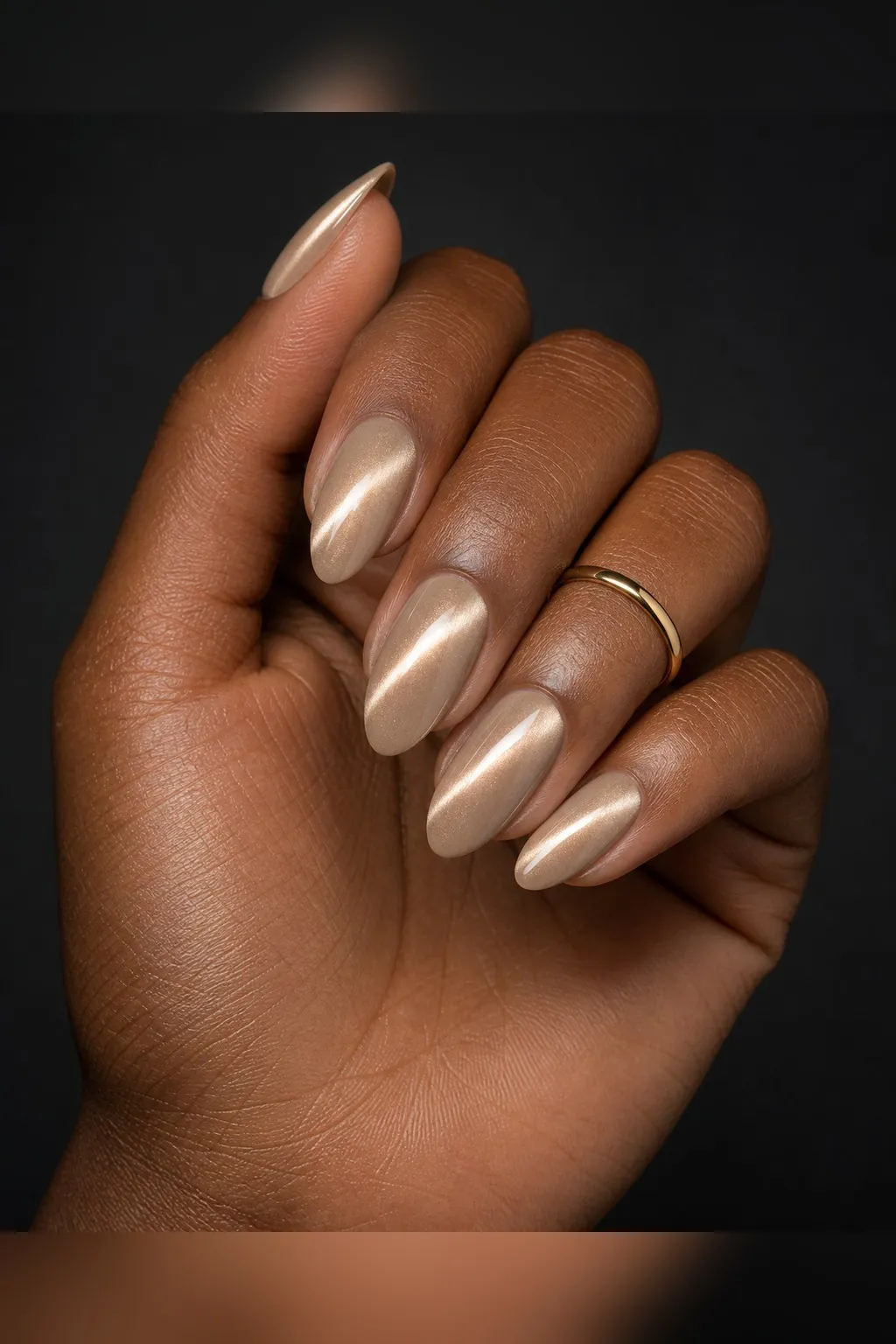 Milk Tea Cat-Eye — almond cat eye nails with milk-tea beige magnetic cat-eye with a soft pearl flash, subtle and warm, glossy, medium almond