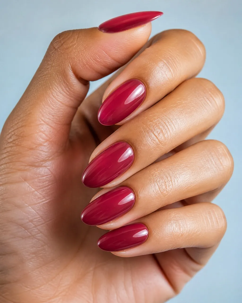 Cranberry Jelly — almond christmas nails with sheer cranberry jelly polish, three thin coats for depth, glossy top coat, medium almond