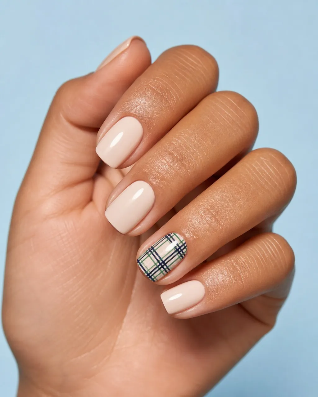 Tartan Ribbon Accent — square christmas nails with sheer nude set with one accent nail in fine green and navy tartan lines, glossy, short square