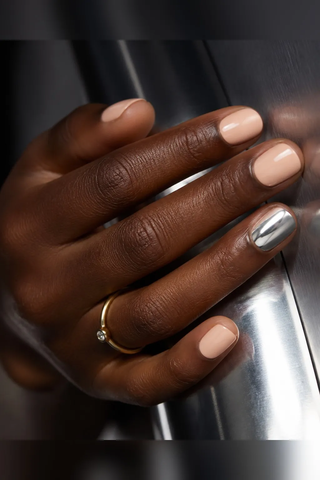 Chrome Accent Nude — round chrome nails with sheer nude crème on every nail with a full silver mirror chrome on the ring fingers only…