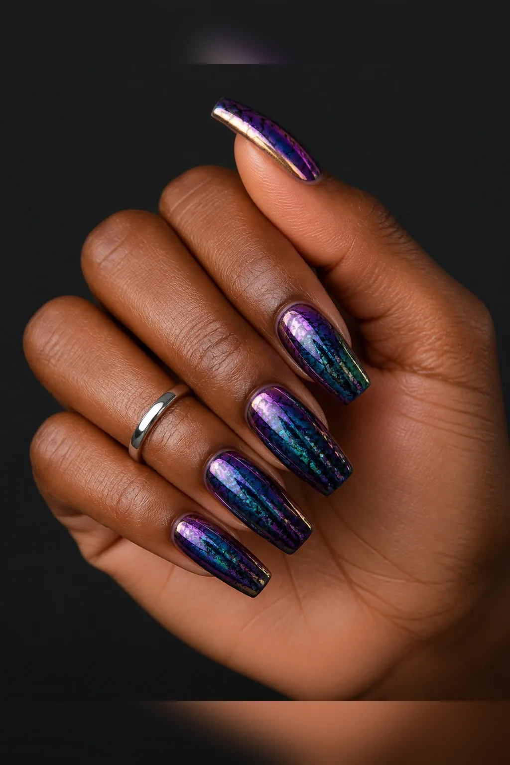 Oil Slick Multichrome — coffin chrome nails with black base with a purple-to-green-to-bronze multichrome powder buffed over, full oil-slick…