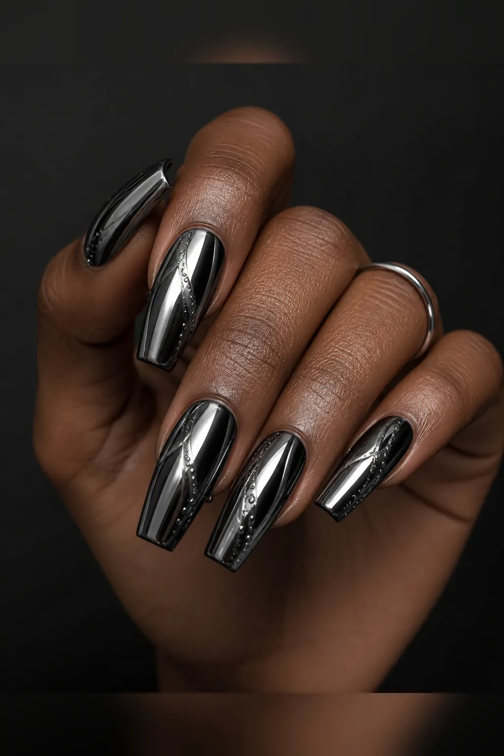 Onyx Chrome — coffin chrome nails with black gel base with mirror chrome powder buffed over for a dark gunmetal shine, glossy seal, medium coffin