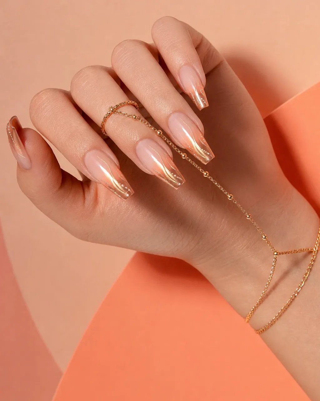 Peach Chrome Ombré — coffin chrome nails with sheer peach base fading into a peach-gold chrome at the tips, soft gradient, glossy, medium coffin