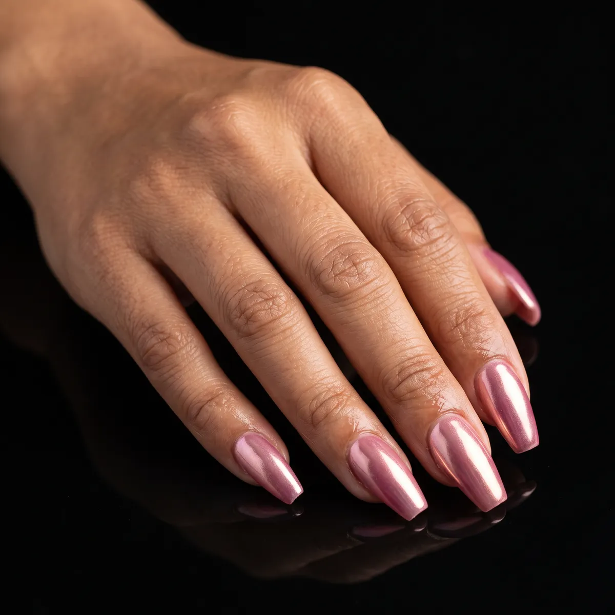 Pink Gold Flash — coffin chrome nails with gel base with pink-gold chrome powder, high-shine sealed top coat, medium coffin shape