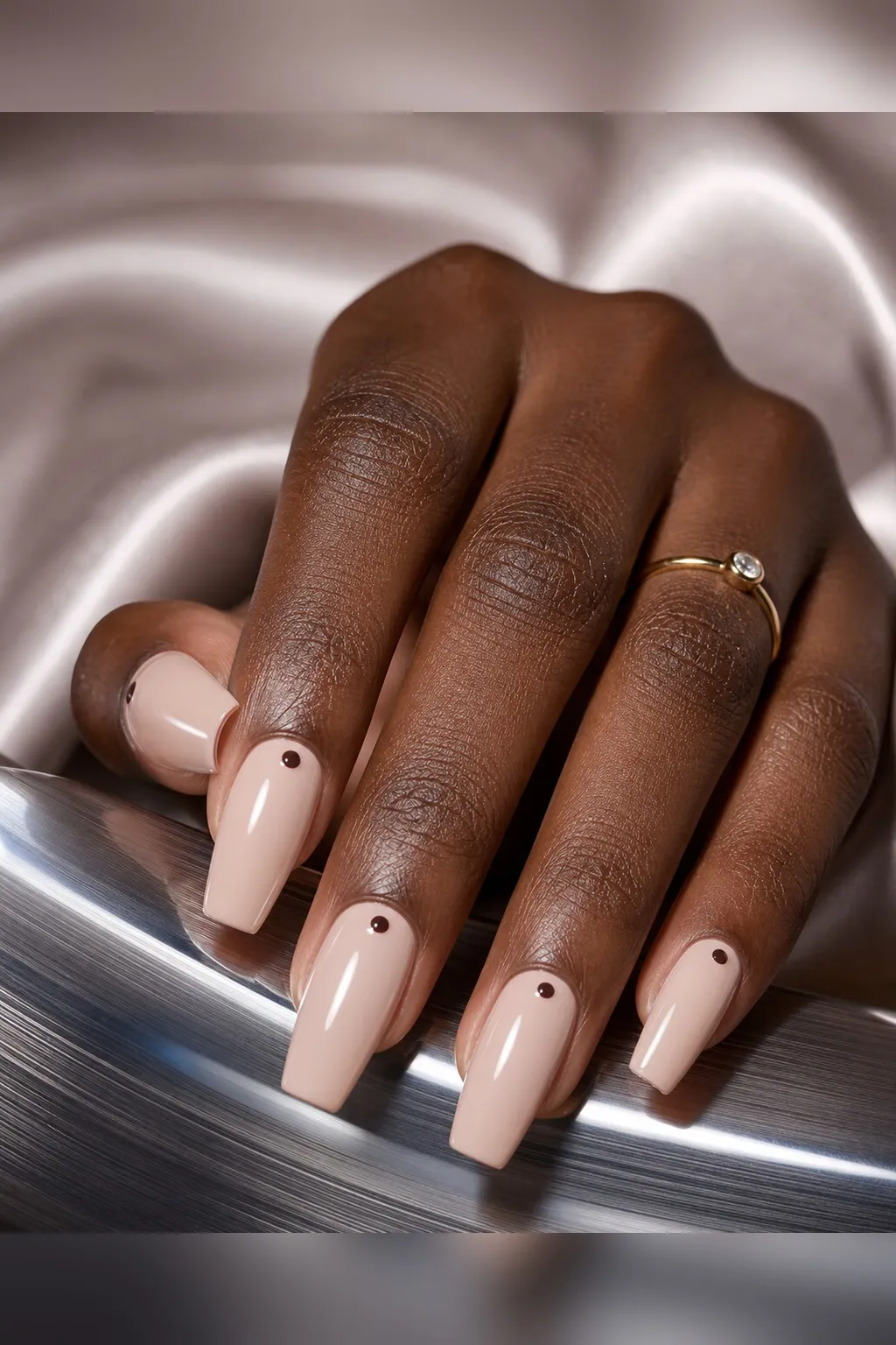 Micro Dot Coffin — coffin nails with sheer nude base with one small espresso-brown dot centred just above the cuticle on each nail, glossy…