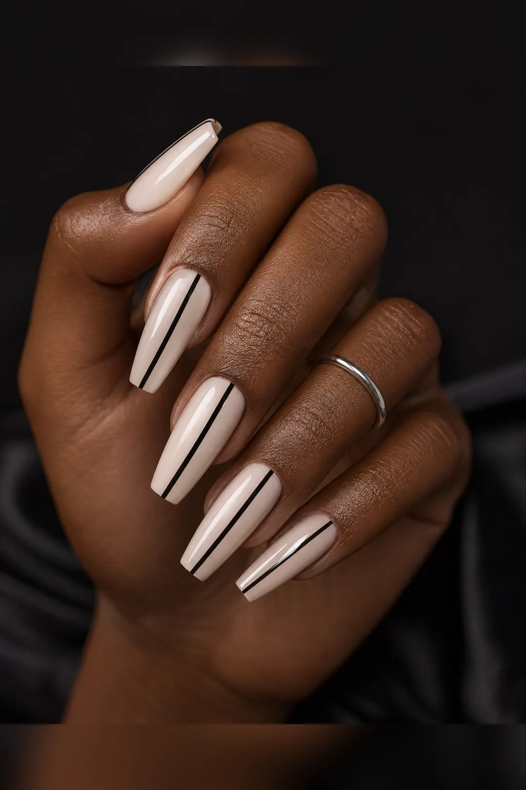 Negative Space Line Coffin — coffin nails with sheer natural base with one thin black vertical line from cuticle to tip, slightly off centre…
