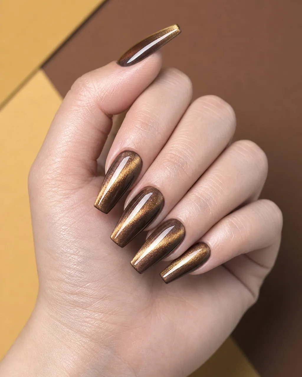Burnished Bronze Cat-Eye — coffin fall nails with bronze magnetic gel, cat-eye technique with magnet, glossy finish, coffin shape