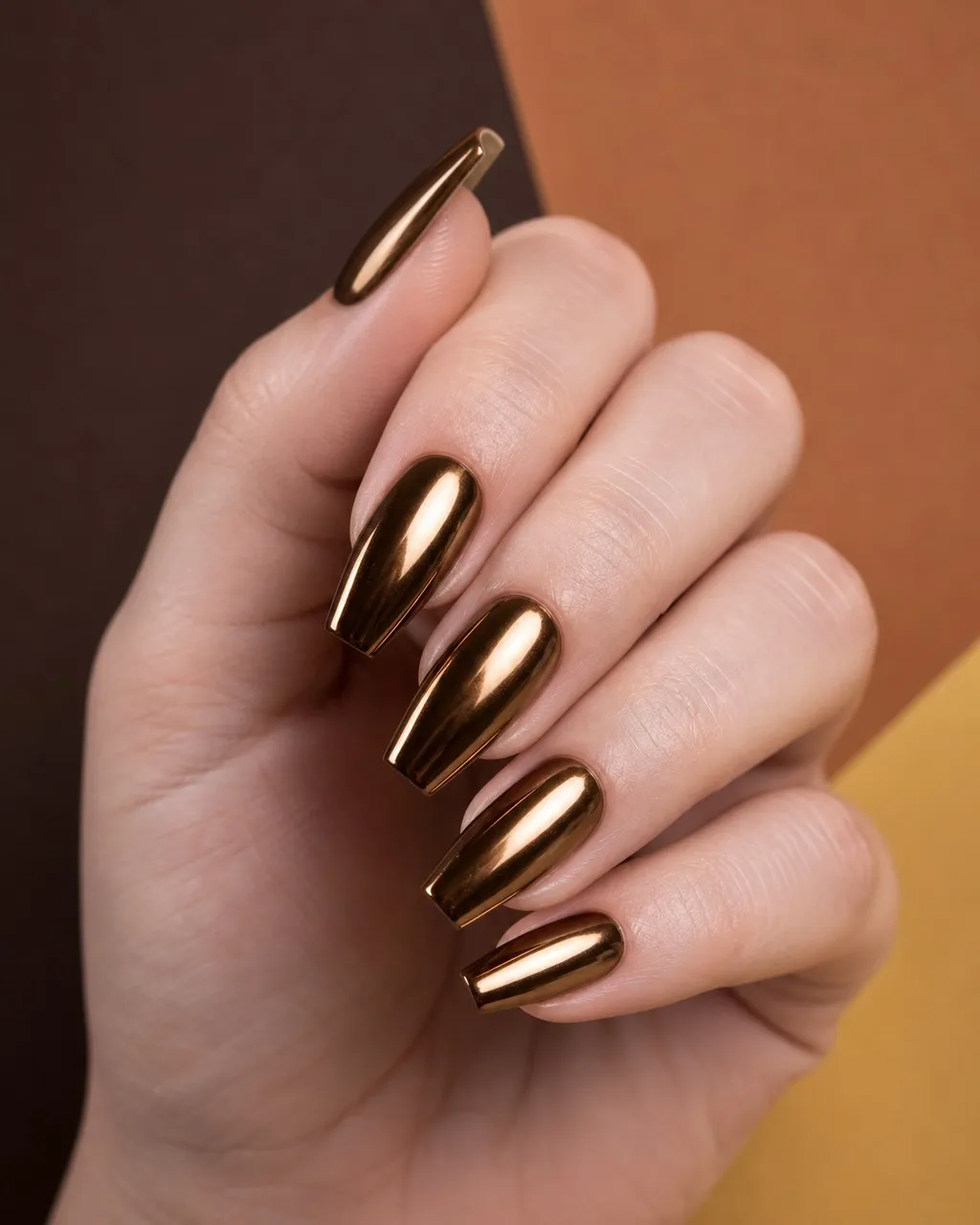 Espresso Martini Chrome — coffin fall nails with espresso brown base, chrome powder mirror finish with gold undertone, coffin shape