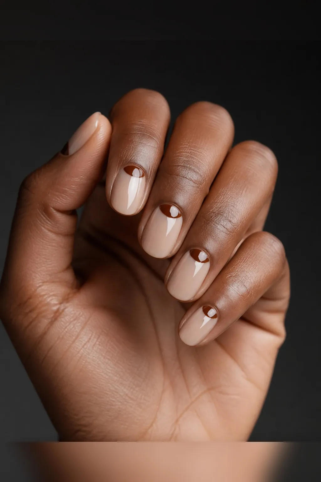 Hazelnut Half-Moon — round fall nails with bare glossy base, reverse half-moon in hazelnut brown at cuticle, round shape