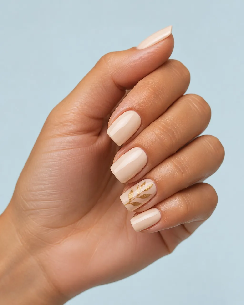 Single Leaf Accent — square fall nails with nude base, one accent nail with hand-painted gold leaf silhouette, glossy, square shape