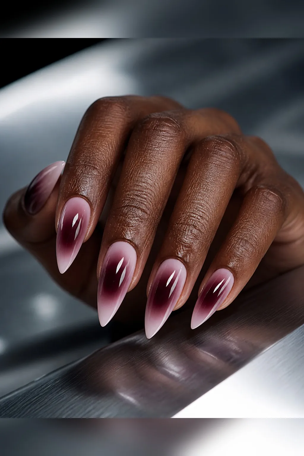 Smoked Plum Aura — stiletto fall nails with sheer base, smoked plum aura darkest at center fading out, stiletto shape