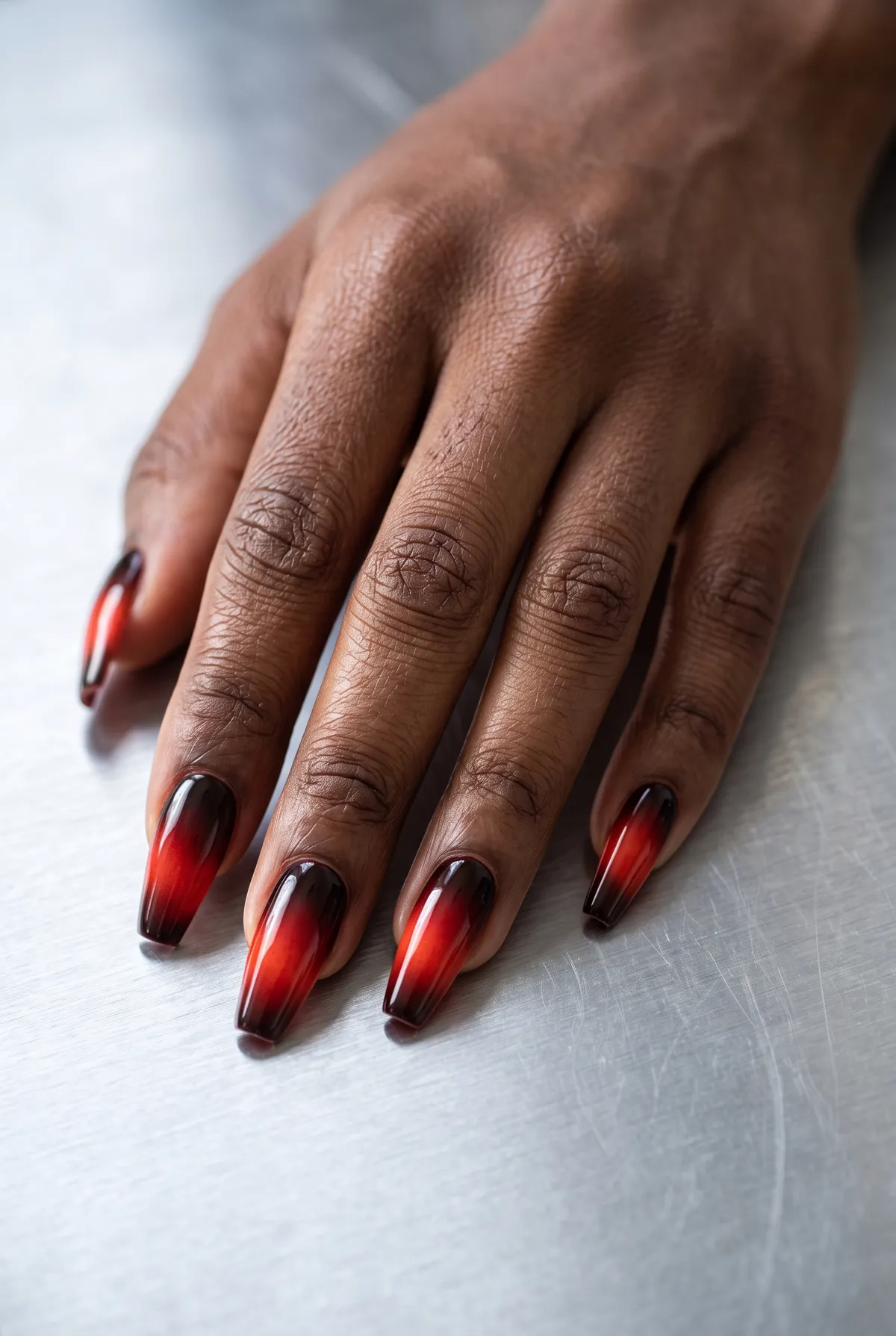 Blood Moon Aura — coffin halloween nails with airbrush a red-orange aura from a black cuticle shadow on coffin nails, finished with glossy…