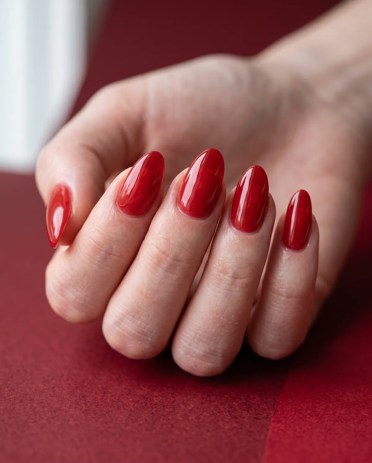 Candy Apple Glaze — almond halloween nails with layer a translucent red jelly gel on almond nails and seal with a high-gloss glaze top coat