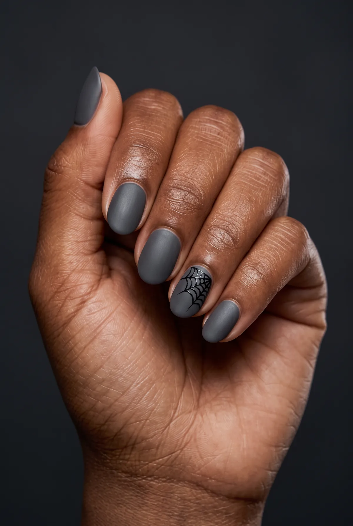 Cobweb Corner Matte — round halloween nails with use a matte charcoal gel base on round nails, then draw a thin black cobweb corner on the…