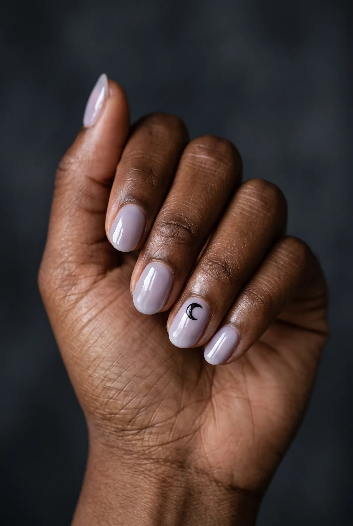 Milk Moon Sheer — round halloween nails with wash a sheer lavender-grey gel over round nails, then paint a small black crescent moon on the…