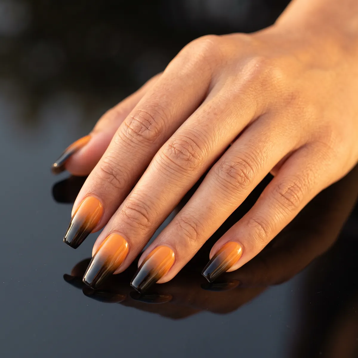 Sunset Coven Ombre — coffin halloween nails with blend a gel ombre from marigold orange at the cuticle into black at the tip on coffin nails
