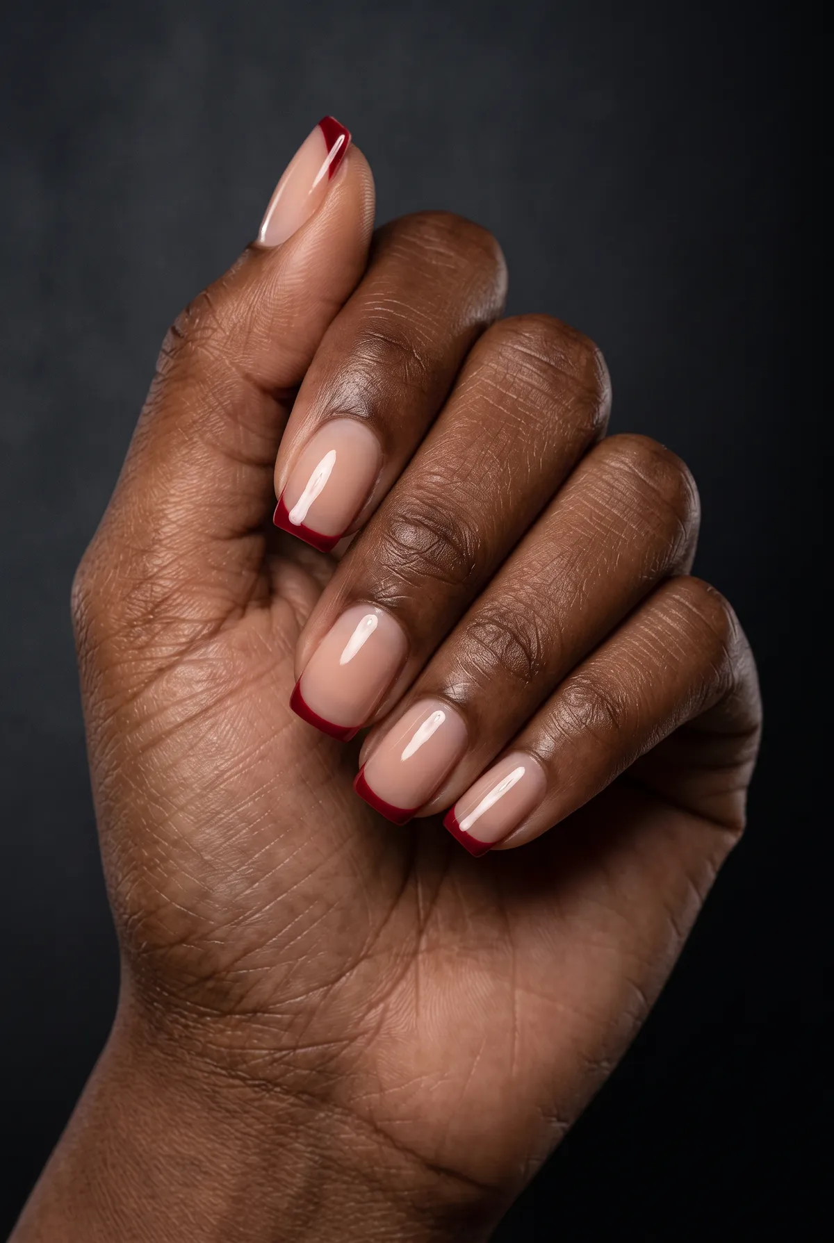 Red Tip — square red nails with i'd like a sheer nude base with a thin red french tip line on short square nails