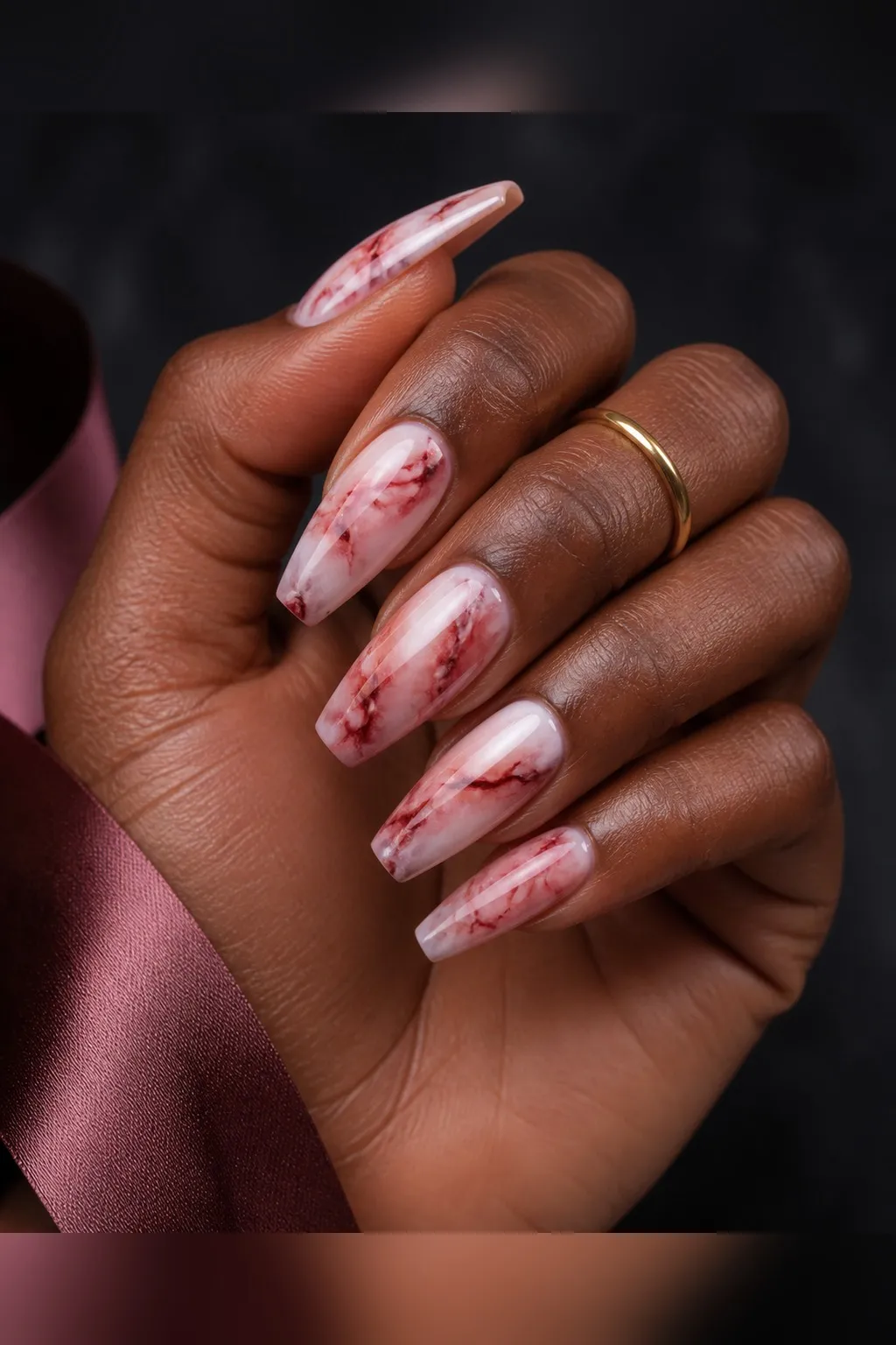 Red White Marble — coffin red nails with milky white base with red marble veins swirled through, blurred edges, glossy, medium coffin