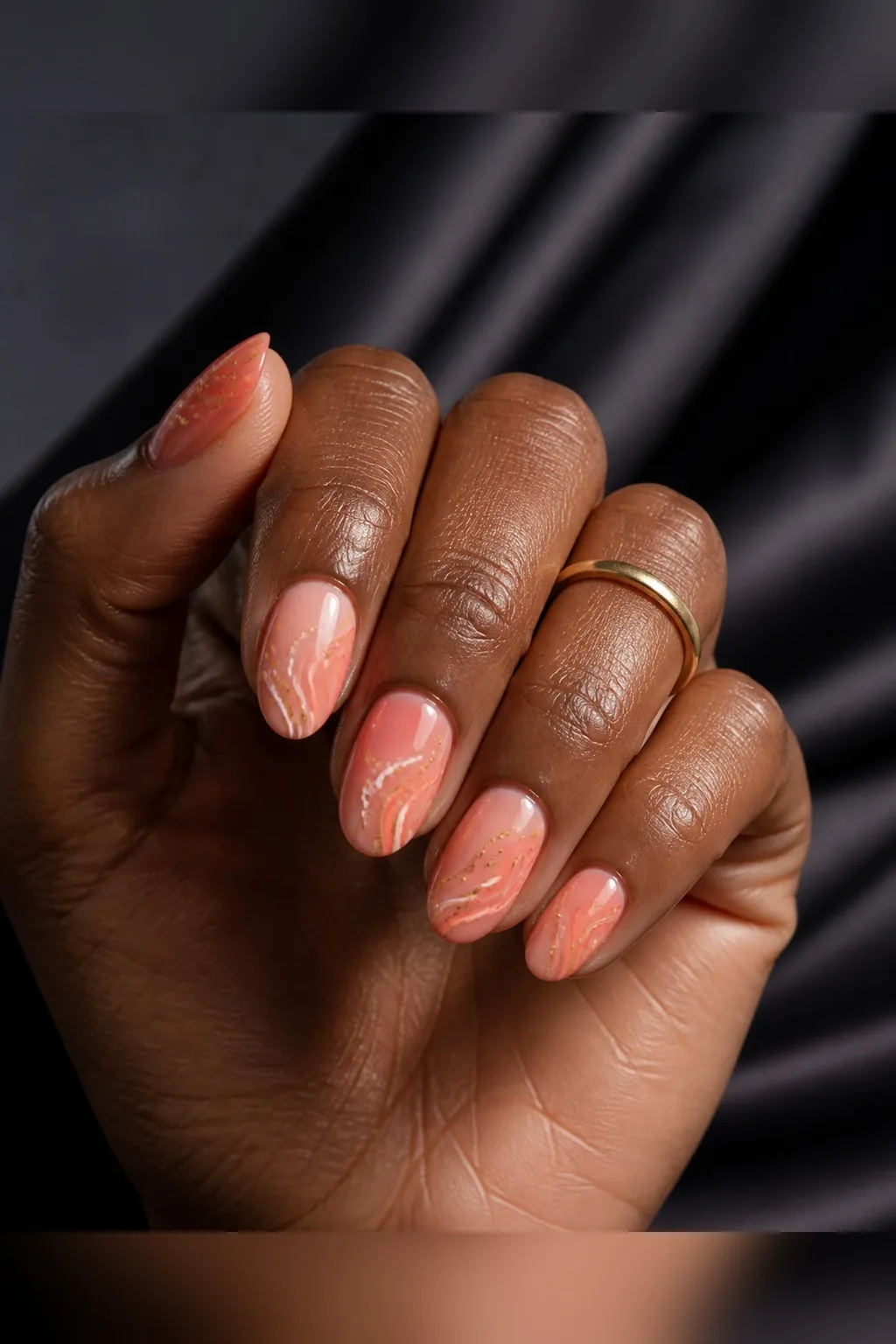 Coral Sheer Short Almond — short almond nails with sheer warm coral polish, two thin coats, glossy top coat, short almond