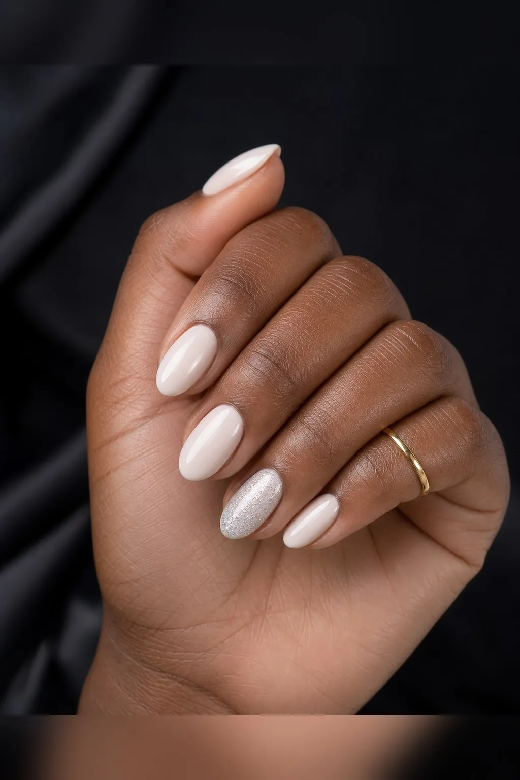 Glitter Accent Short Almond — short almond nails with sheer milky base on every nail, with fine silver glitter on the ring fingers only…