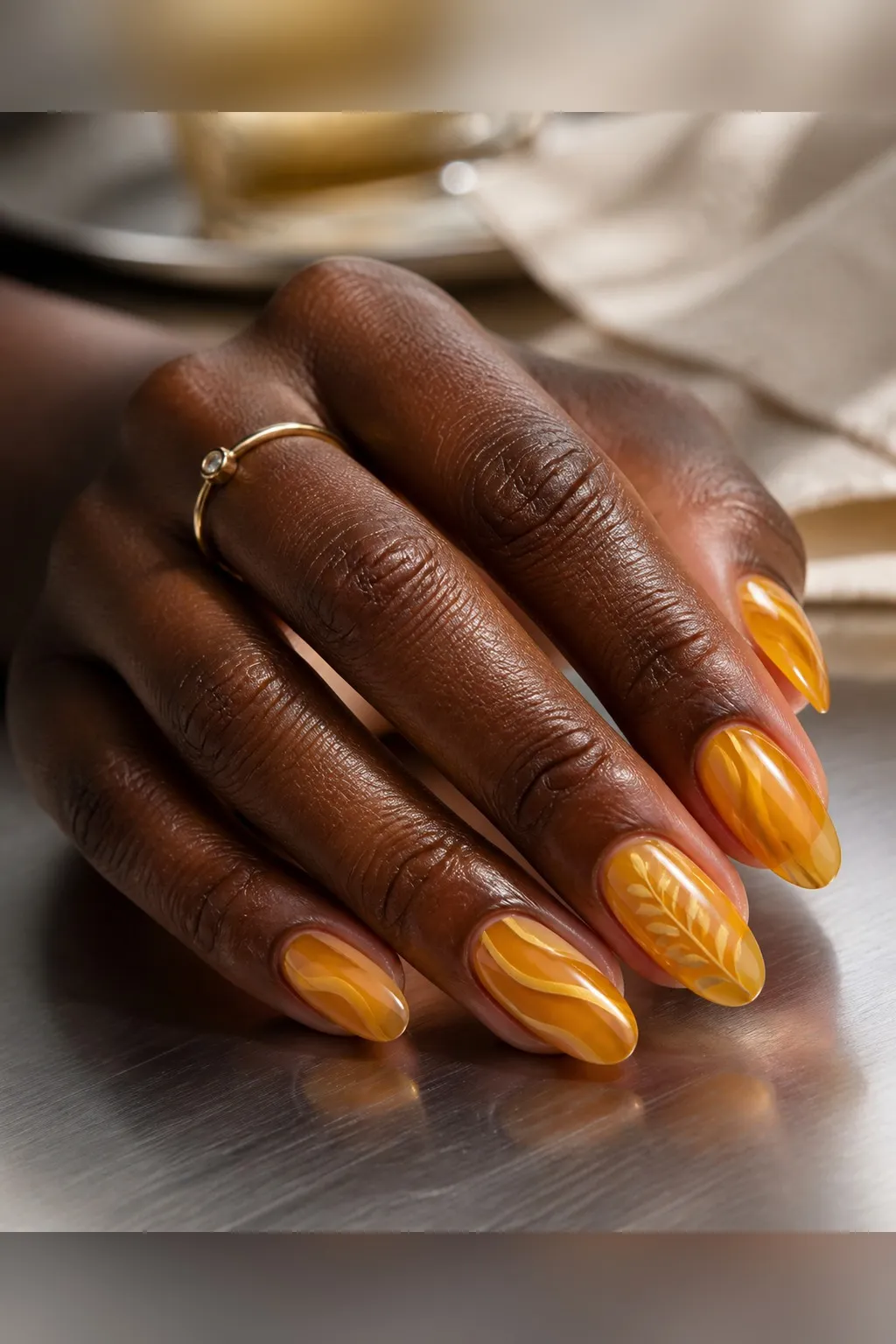 Amber Honey Jelly — almond thanksgiving nails with sheer amber-honey jelly polish, three thin coats for depth, glossy top coat, medium almond