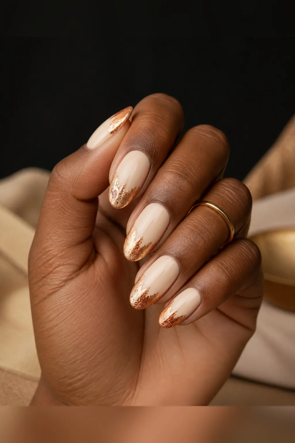 Bronze Leaf Tips — almond thanksgiving nails with sheer cream base with bronze metallic foil pressed into the tips with soft ragged edges…