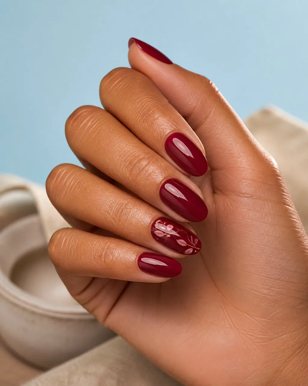 Cranberry Sauce Glaze — almond thanksgiving nails with deep cranberry crème, two coats, under a high-gloss glaze top coat, medium almond