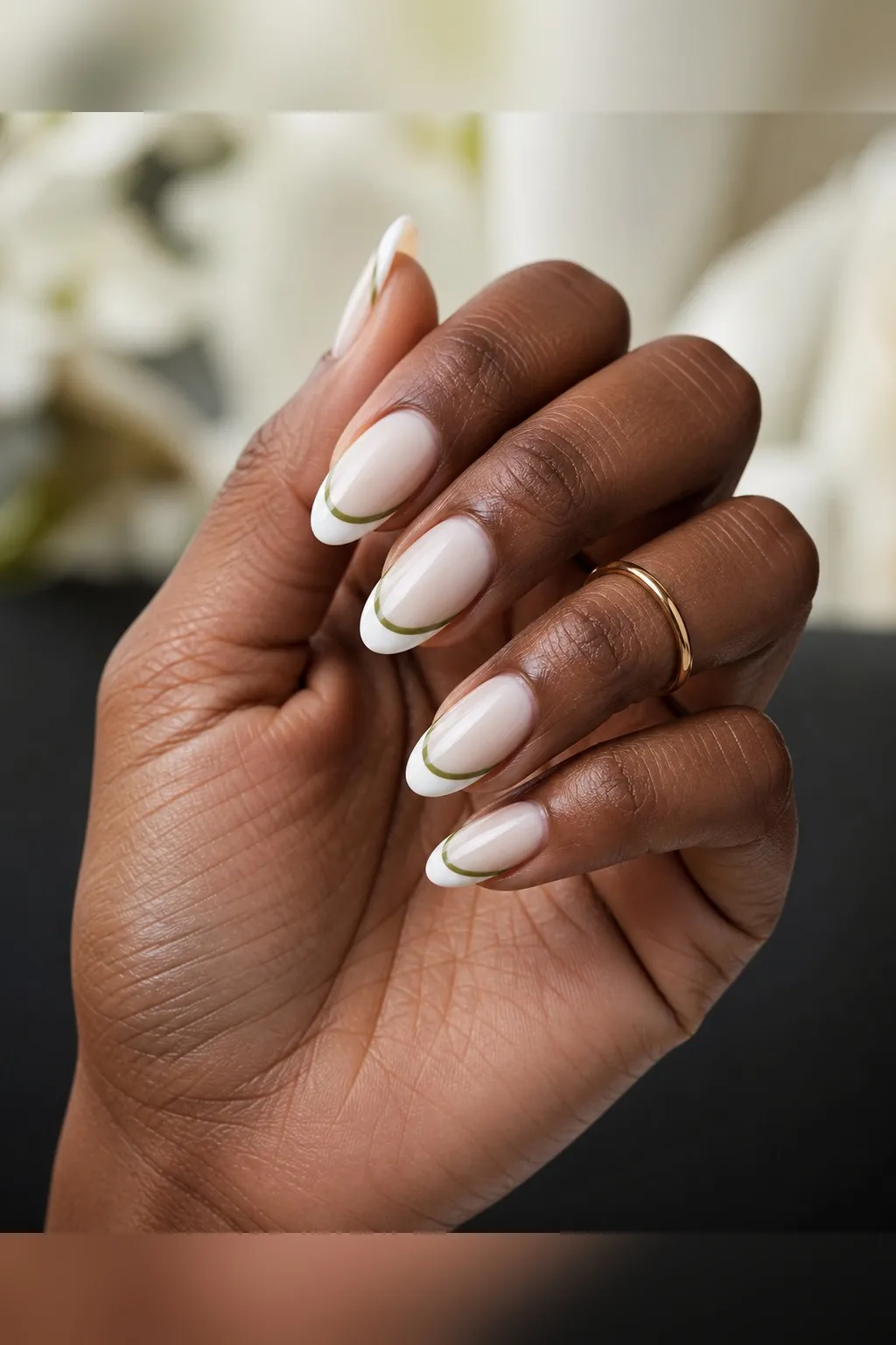 Olive Hairline French — almond french nails with sheer milky base with a white french tip and a hairline of olive green just beneath the…
