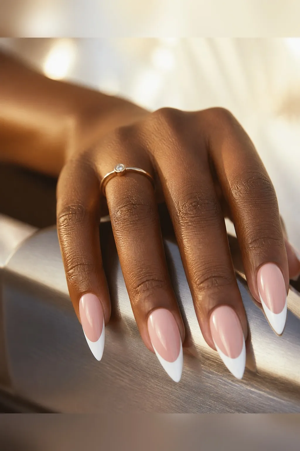 White French Stiletto — stiletto french nails with sheer pink base with a white french tip following the taper to a point, deep smile line…