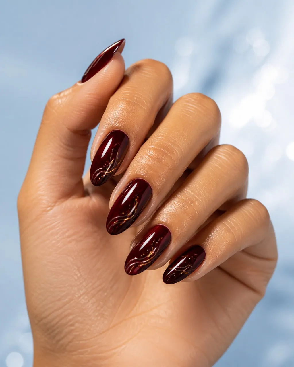 Black Cherry Glaze — almond winter nails with near-black cherry-red crème, two coats, under a high-gloss glaze top coat, medium almond