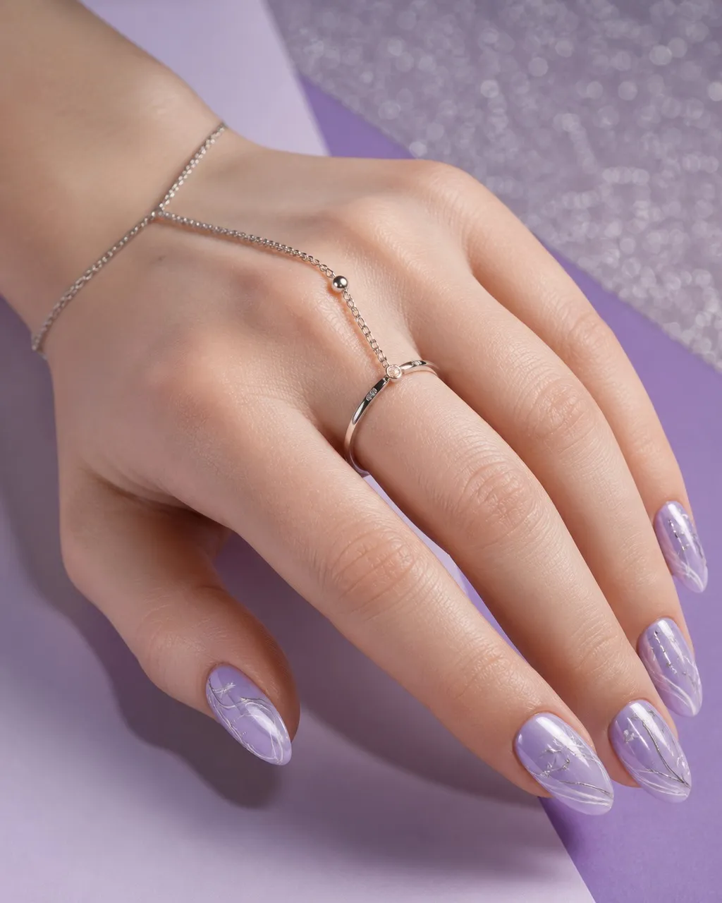 Frosted Lavender Chrome — almond winter nails with pale lavender base with a pearl chrome powder buffed over for a frosted shine, glossy…