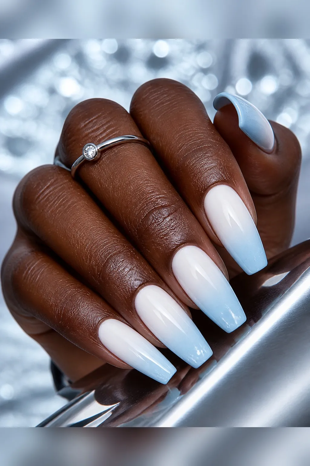 Snow to Blue Ombré — coffin winter nails with white fading to pale ice blue at the tips, soft sponge-blended ombré, glossy seal, medium coffin